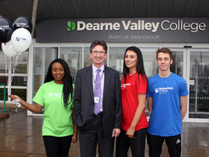 Image of John Connolly and students outside Dearne Valley College.