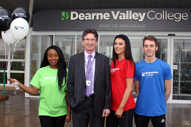 Image of John Connolly and students outside Dearne Valley College.