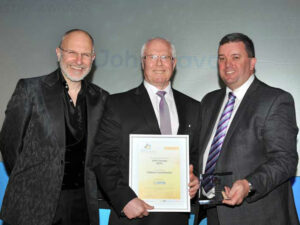 Mr John R Savage, the founder and Director of the National Fluid Power Centre (NFPC) receiving his award