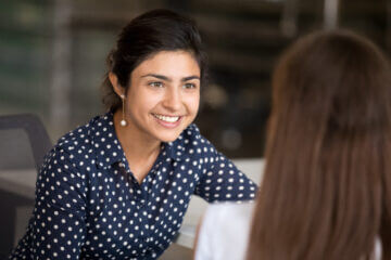 A lady, smiling