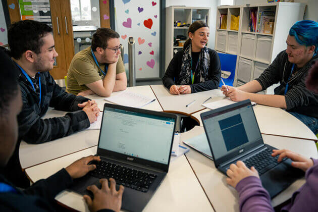 FLEX students sat around a table