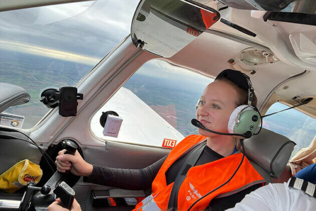 A student flying a plane on our aviation course