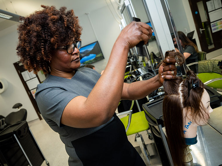 A student working in the DVC salon