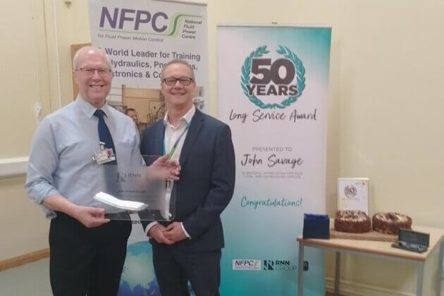 RNN Group CEO and Principal Jason Austin, awarding John Savage has 50 years long service award.