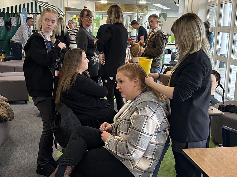 Hair braiding at Education Encompassed Day