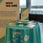 A table and banner display at the RNN Group Business Breakfast