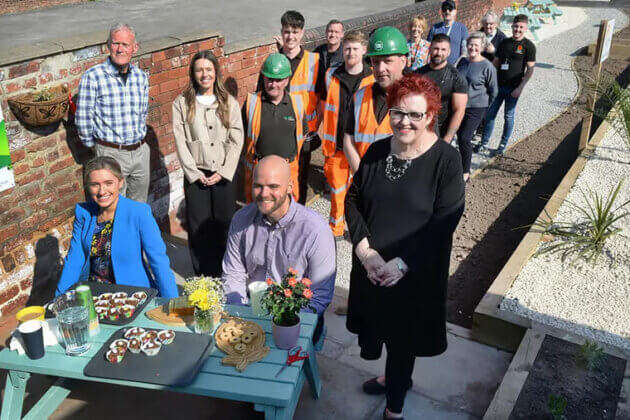 RNN Group students and Esh Construction celebrating transforming a community garden
