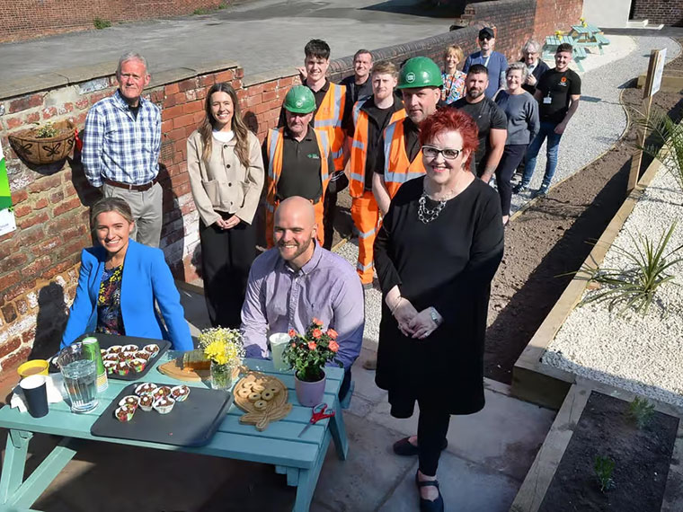 RNN Group students and Esh Construction celebrating transforming a community garden