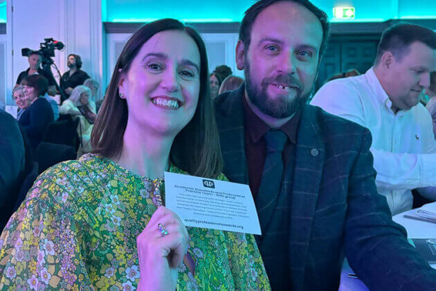 Two members of staff at the Quality Awards Ceremony 2025