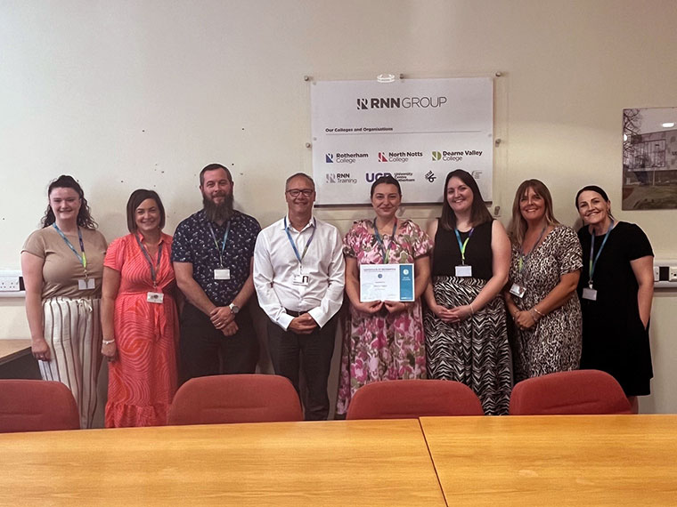 Marina Teglas stood with colleagues after recieving a kudos award
