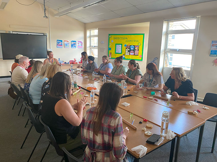 Staff taking part in an activity at a wellbeing day