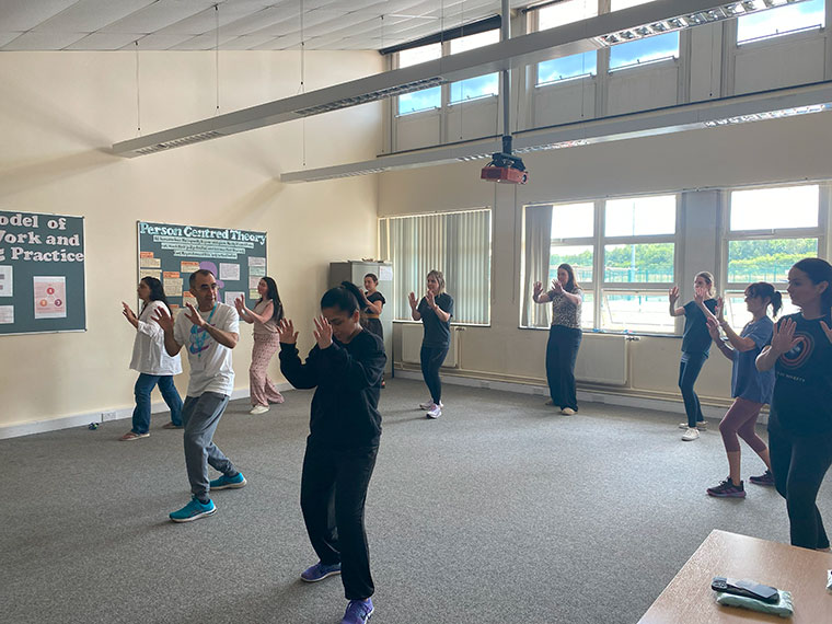 Staff taking part in an activity at a wellbeing day