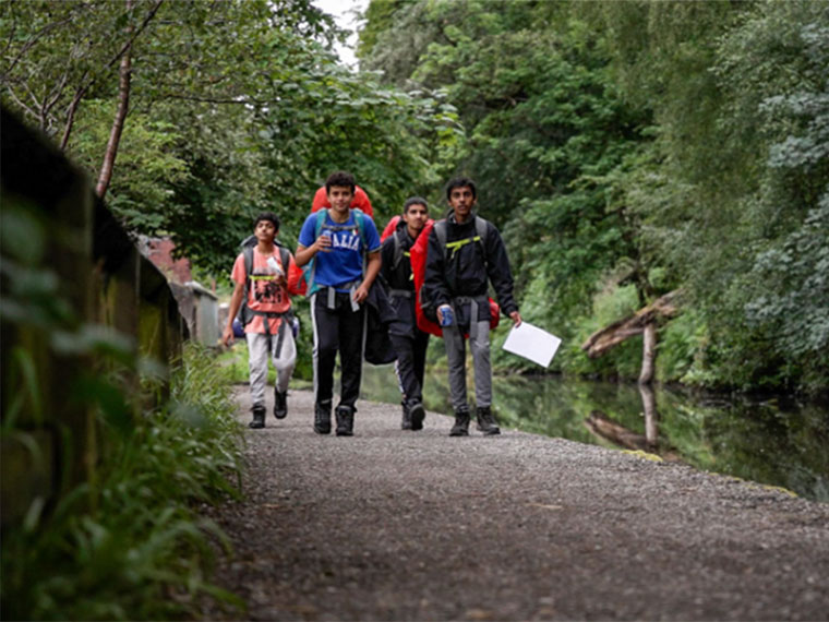 DofE Award students walking with backpacks on