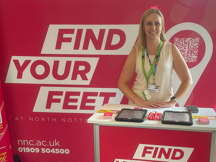 Lucy Kingston at an open event with a Find Your Feet banner behind