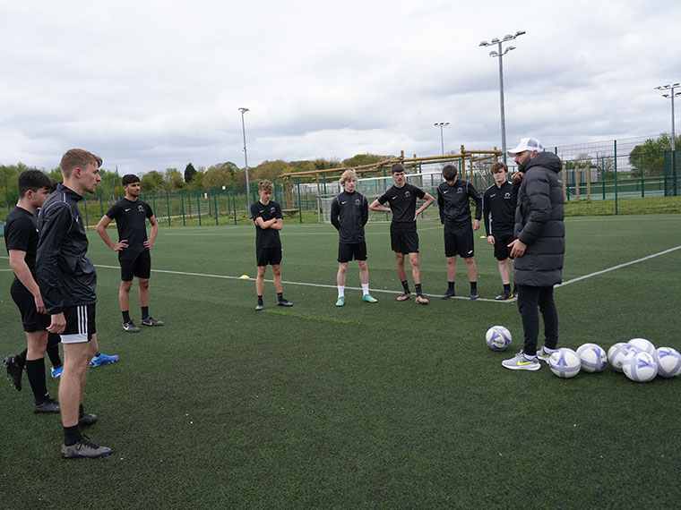 Momentous Football Academy students training outdoors