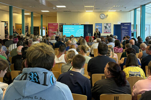 A group of people listening to the Director of Campus speak at North Notts College