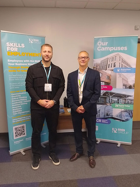 Jason Austin with a member of staff from Barnsley and Rotherham Chamber of Commerce