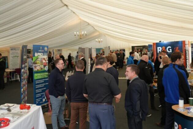 Guests engaging with stalls at the NFPC Industry Day Exhibition