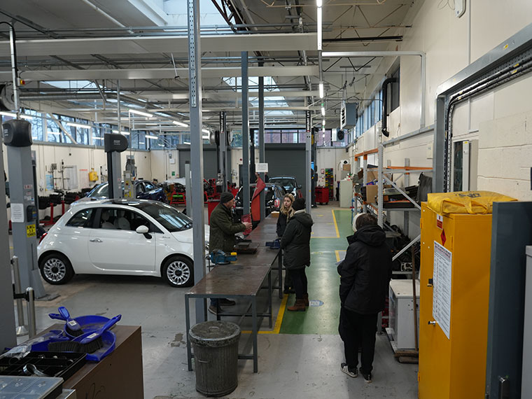 People looking around the sustainable automotic training centre at North Notts College