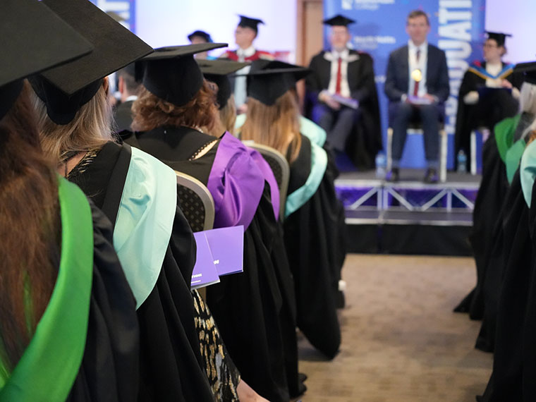 Graduates seated in the ceremony room
