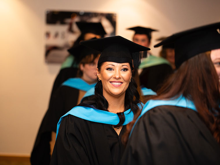 A head and shoulders shot of a student on graduation day