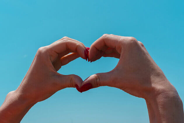 Someone's hands making a hearth shape
