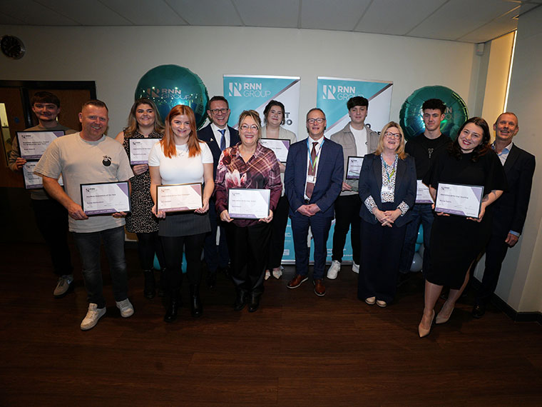 A group of apprentices with their certificates at the National Apprenticeship awards
