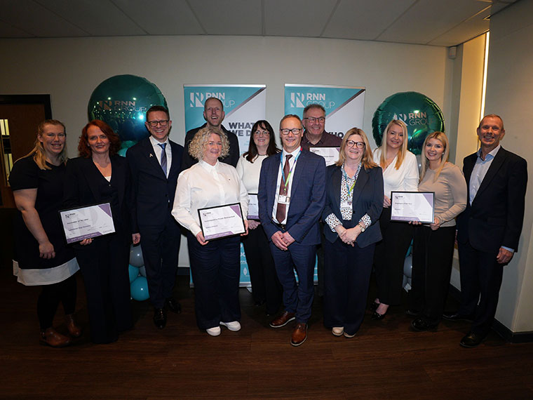 A group of apprentices with their certificates at the National Apprenticeship awards