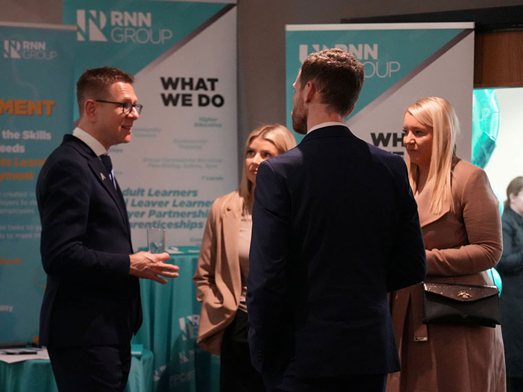 Anthony Impey MBE talking with people at the National Apprenticeship awards