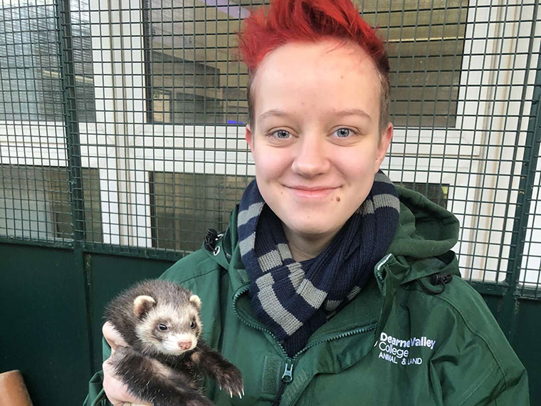 UCR Animal Management student Finn holding an animal