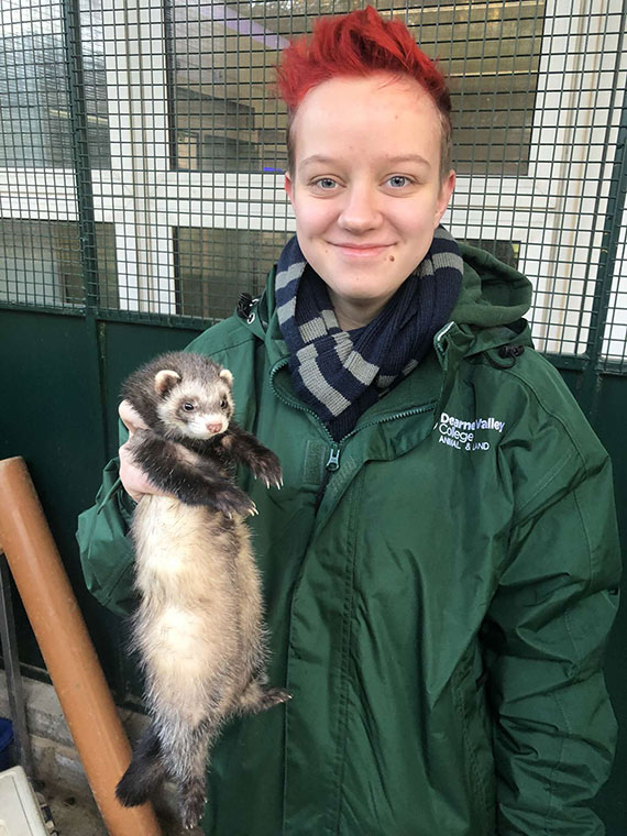 UCR Animal Management student Finn holding an animal