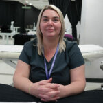Student Lucy, sat in a beauty salon setting