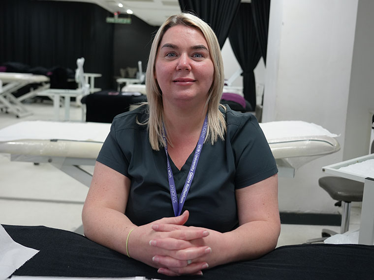 Student Lucy, sat in a beauty salon setting