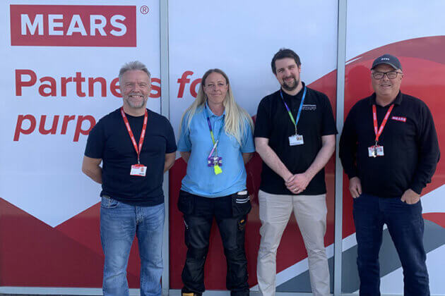 Four people from Mears Group and RNN Group stood together