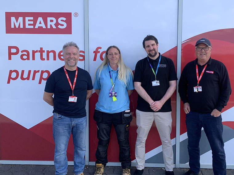 Four people from Mears Group and RNN Group stood together