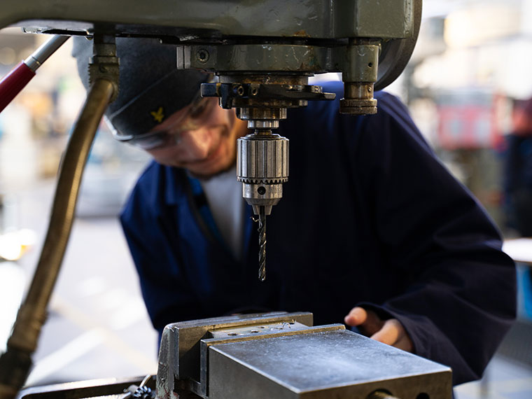 Someone using engineering equipment