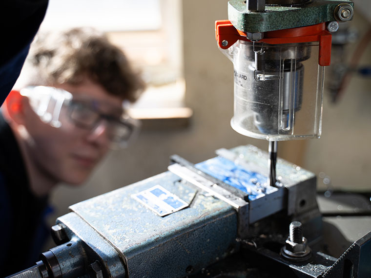Someone looking up into engineering equipment