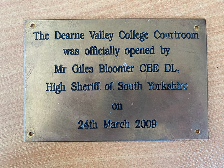 A plaque that reads; The Dearne Valley College Courtroom was officially was officially opened by Mr Giles Bloomer OBE DL, High Sheriff of Yorkshire on 24th March 2009.