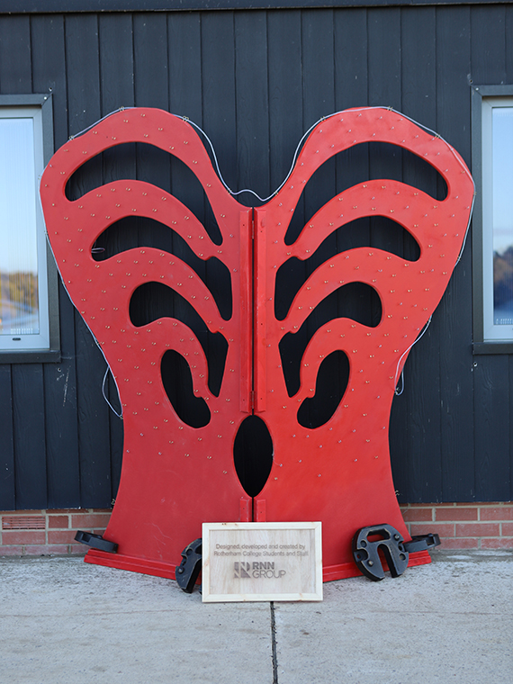 A large orange heart sculpture