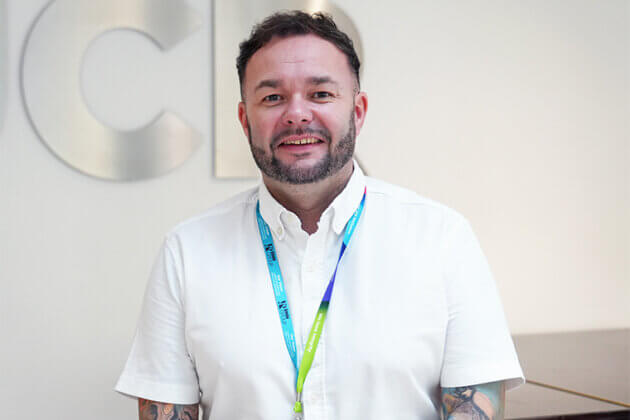 Conal White, Accounting Tutor - male with short dark hair wearing a white short sleeved shirt