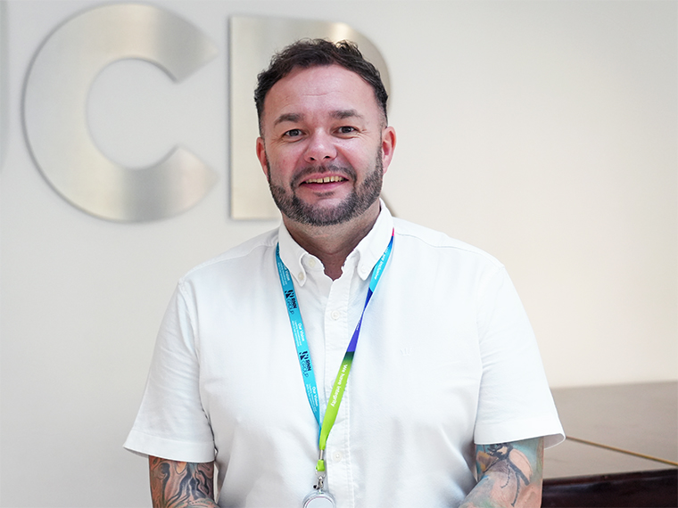 Conal White, Accounting Tutor - male with short dark hair wearing a white short sleeved shirt
