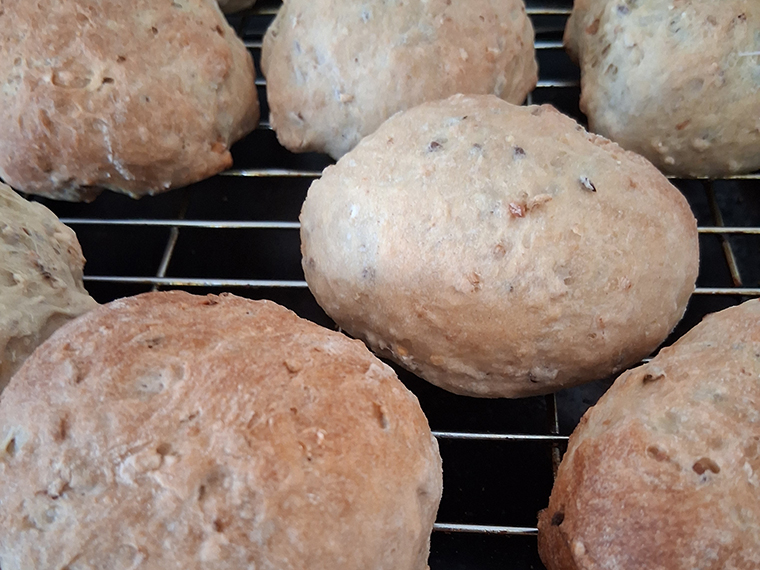 Several freshly baked bread rolls